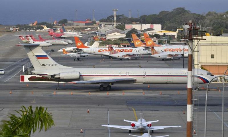 A Russian Ilyushin Il-62 air force plane, one of two Russian military planes that arrived on March 23, 2019 with troops and equipment, sits on the tarmac at an airport near Caracas; the Trump administration has sharply protested the Russian presence