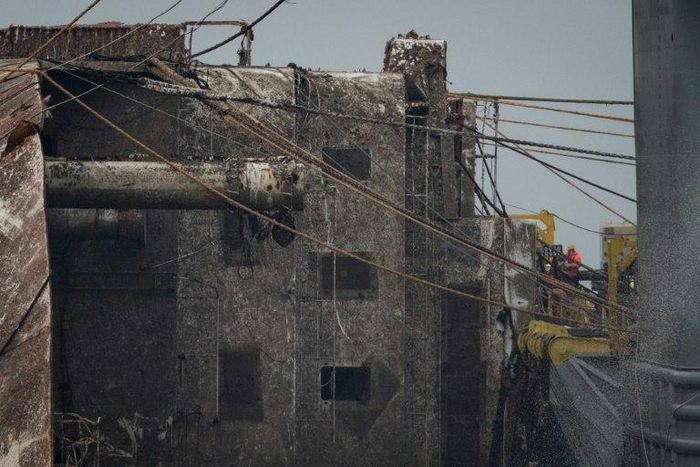 The top of the Sewol has been raised to 13 metres above sea-level, just high enough to fit onto a vessel that will take it to port