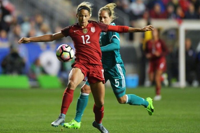 Lynn Williams of the United States knocks the ball away from Babett Peter of Germany during the SheBelieves Cup at Talen Energy Stadium in Chester, Pennsylvania, on March 1, 2017