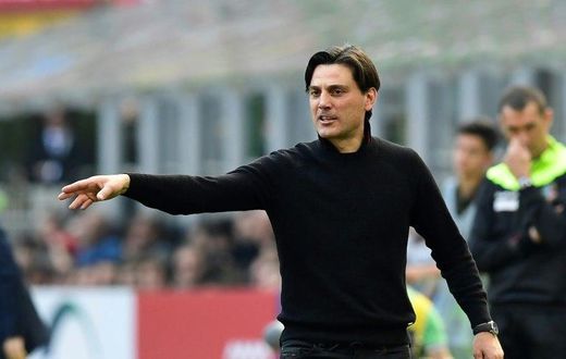 AC Milan's coach Vincenzo Montella follows the action during their Italian Serie A match against Palermo, at the San Siro stadium in Milan, on April 9, 2017