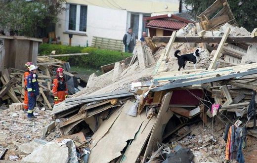 Rescuers search after a building collapsed burying several people in Swiebodzice, Poland on April 8, 2017