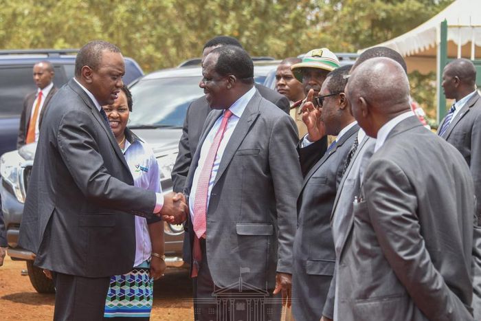 President Uhuru shakes hands with CoG Chair Wycliffe Oparanya when he arrived for the 2019 Devolution Conference in Kirinyaga County