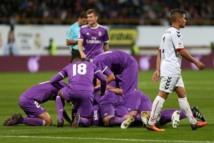 Real Madrid players celebrate a goal against Cultural y Deportiva Leonesa in Leon, on October 26, 2016