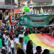 Participants, many from Hong Kong's LGBT community, take part in their annual pride parade through the streets with a large rainbow flag on November 26, 2016