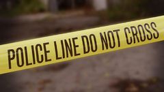 A crime scene cordoned off with police yellow tape