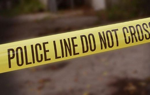 A crime scene cordoned off with police yellow tape