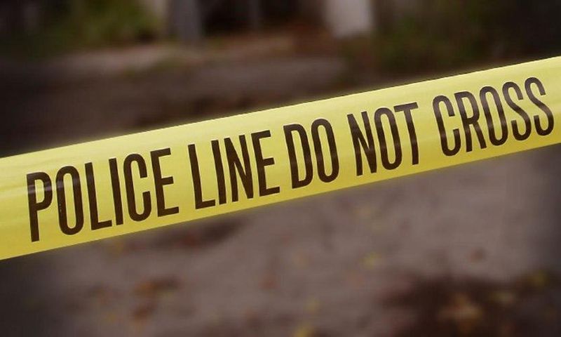 A crime scene cordoned off with police yellow tape