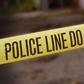 A crime scene cordoned off with police yellow tape