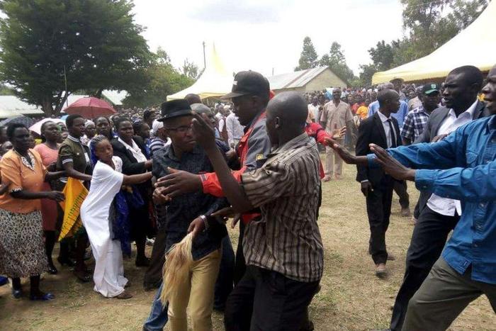 ODM politician Moses Nandalwe aka 'Mr Money Bags' forces his way into the funeral