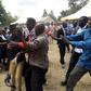 ODM politician Moses Nandalwe aka 'Mr Money Bags' forces his way into the funeral