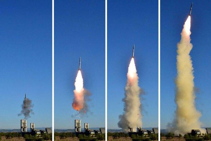 This combo shows undated pictures released from North Korea's official Korean Central News Agency on May 28, 2017 of the test of a new anti-aircraft guided weapon system organized by the Academy of National Defence Science at an undisclosed location