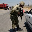 A Turkish soldier checks cars during a 2015 security operation in Diyarbakir