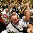Real Madrid's supporters celebrate at a bar in Madrid on June 3, 2017