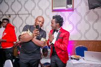 Jalang'o and Bahati. Celebrities at the EMB Rebirth Party . Bahati signs Dany Gift