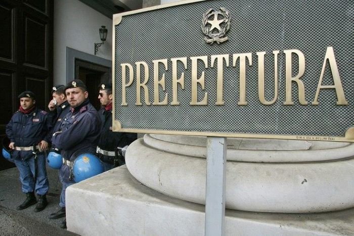 Police, seen here standing outside the Naples' prefecture, spent two years investigating the scam