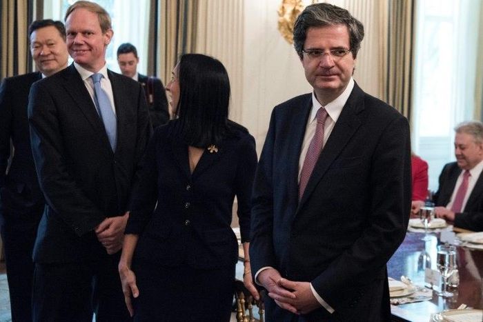 Britain's Ambassador to the United Nations Matthew Rycroft (2L) and France's Ambassador to the United National Francois Delattre (R) wait for a luncheon with UN Security Council member nations in the White House April 24, 2017 in Washington, DC