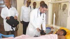 One of the Cuban doctors assigned to Mandera County Dr Landy Rodriguez attends to a patient after performing a past operation