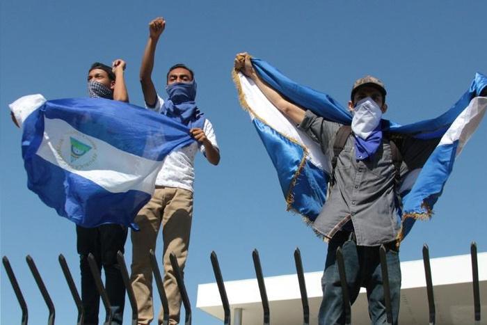 The talks had been suspended after opposition protesters, such as those pictured here in Managua, were temporarily detained by police who used tear gas to prevent an anti-government protest