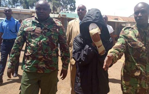 Naftali Njahi Kinuthia escorted by police to his first court appearance following murder of Ivy Wangechi (Twitter)
