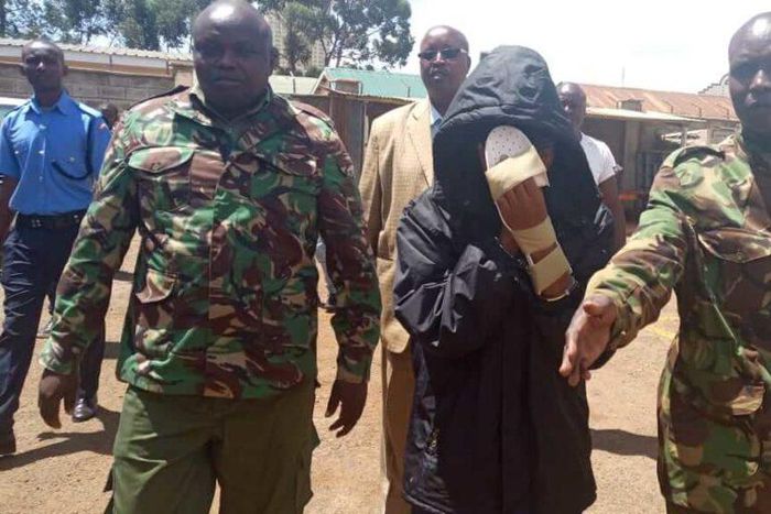 Naftali Njahi Kinuthia escorted by police to his first court appearance following murder of Ivy Wangechi (Twitter)