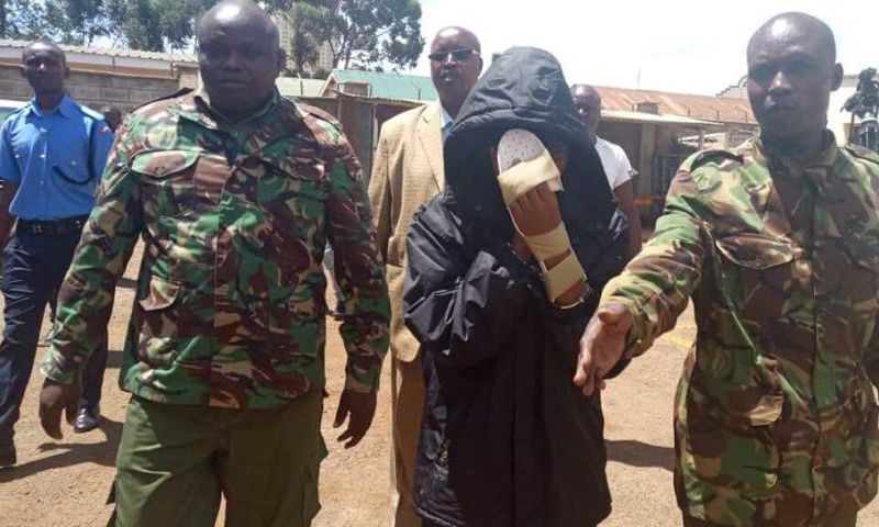 Naftali Njahi Kinuthia escorted by police to his first court appearance following murder of Ivy Wangechi (Twitter)
