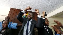 A policeman leads the handcuffed officials of the Kenya Medical Practitioners, Pharmacists and Dentist Union (KMPDU) on February 13, 2017 in Nairobi.