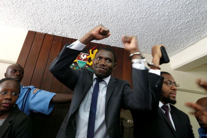 A policeman leads the handcuffed officials of the Kenya Medical Practitioners, Pharmacists and Dentist Union (KMPDU) on February 13, 2017 in Nairobi.
