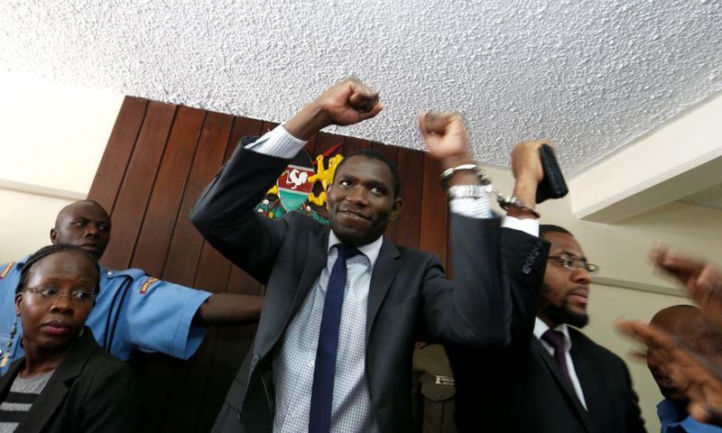 A policeman leads the handcuffed officials of the Kenya Medical Practitioners, Pharmacists and Dentist Union (KMPDU) on February 13, 2017 in Nairobi.