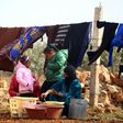 Displaced Syrians, who fled their hometowns due to clashes between regime forces and the Islamic State (IS) group, do their laundry in Kharufiyah, 18 kilometres south of Manbij, on March 4, 2017