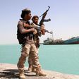 Yemeni pro-regime forces patrol the port of Mokha, on February 9, 2017
