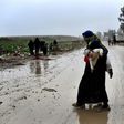 An Iraqi woman return to an area of west Mosul liberated from the Islamic State group