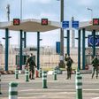 Military personnel patrol at the checkpoint of the frontier police at the northern French port city of Calais