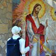 A Catholic pilgrim prays in the southern Bosnian village of Medjugorje, although Pope Francis expressed doubts about reported daily apparitions of the Virgin there