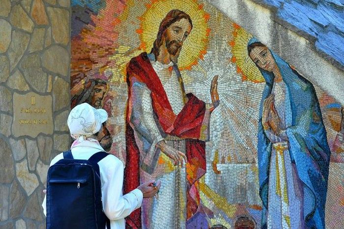 A Catholic pilgrim prays in the southern Bosnian village of Medjugorje, although Pope Francis expressed doubts about reported daily apparitions of the Virgin there