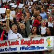 England fans cheer for their team during the international friendly football match between England and Peru at Wembley Stadium in north London on May 30, 2014
