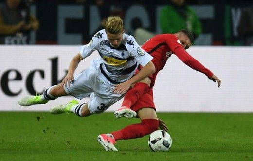 Frankfurt's forward Branimir Hrgota and Moenchengladbach's defender Nico Elvedi vie for the ball during the German Cup DFB Pokal semifinal football match between Borussia Moenchengladbach and Eintracht Frankfurt on April 25, 2017