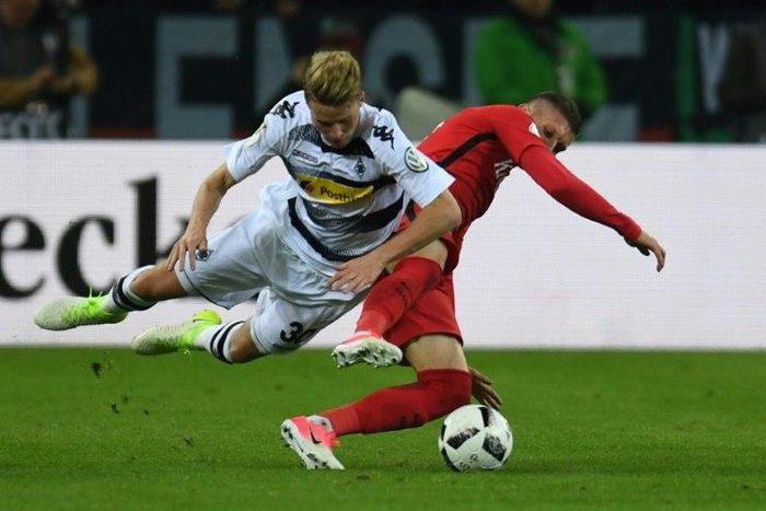 Frankfurt's forward Branimir Hrgota and Moenchengladbach's defender Nico Elvedi vie for the ball during the German Cup DFB Pokal semifinal football match between Borussia Moenchengladbach and Eintracht Frankfurt on April 25, 2017