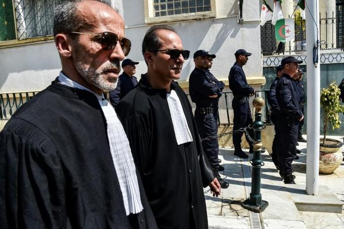 Algerian lawyers and judges gather to support the independence of the judiciary outside the Justice Ministry in Algiers on April 13, 2019. Magistrates who play a key role overseeing the country's elections, say they will boycott a July 4 presidential e...