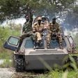 Soldiers of the Sudan People Liberation Army (SPLA) cross the Nile River on a tank near Malakal, northern South Sudan, on October 16, 2016