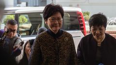 Hong Kong's former deputy leader Carrie Lam (C) arrives at the city's High Court to testify in the high-profile corruption trial of former Hong Kong chief executive Donald Tsang (not pictured) on January 26, 2017