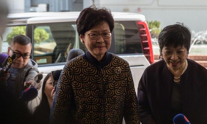 Hong Kong's former deputy leader Carrie Lam (C) arrives at the city's High Court to testify in the high-profile corruption trial of former Hong Kong chief executive Donald Tsang (not pictured) on January 26, 2017