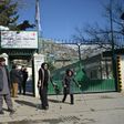 The flag of the International Committee of the Red Cross flies at half-mast at the entrance to the ICRC Orthopaedic Centre in Kabul on February 9, 2017