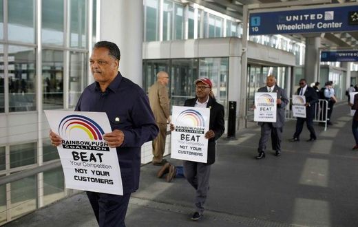 US civil rights activist the Reverend Jesse Jackson led a protest against United Airlines at O'Hare airport over the violent dragging of a paid passenger from his seat to accommodate the airline's overbooking of the flight