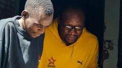 Zimbabwean pastor and activist Evan Mawarire (r) was arrested on January 16 on charges of incitement to violence over his support for a national strike over soaring petrol prices