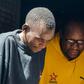 Zimbabwean pastor and activist Evan Mawarire (r) was arrested on January 16 on charges of incitement to violence over his support for a national strike over soaring petrol prices
