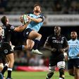 Sharks' Curwin Bosch (L) and Waratahs' Andrew Kellaway go for the ball during their Super Rugby match, at Kings Park rugby stadium in Durban, South Africa, on March 11, 2017