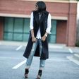 Blogger Stella of Jadore Fashion pulls a chic blazer dress over shirt and boyfriend jeans
