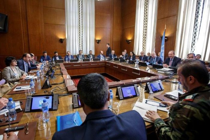 Syria's main opposition High Negotiations Committee (HNC) leader Nasr al-Hariri (2ndL) and UN Special Envoy of the Secretary-General for Syria Staffan de Mistura (3rdR) take part in a new round of Syria peace talks on May 16, 2017 in Geneva
