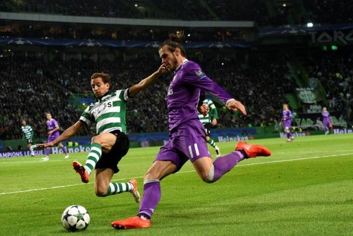Gareth Bale clashes with Sporting's Joao Pereira during the Champions League match in Lisbon in November