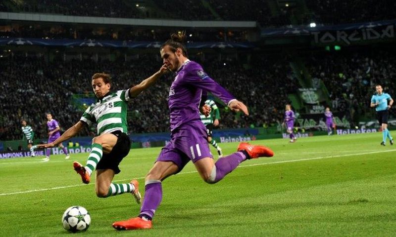 Gareth Bale clashes with Sporting's Joao Pereira during the Champions League match in Lisbon in November